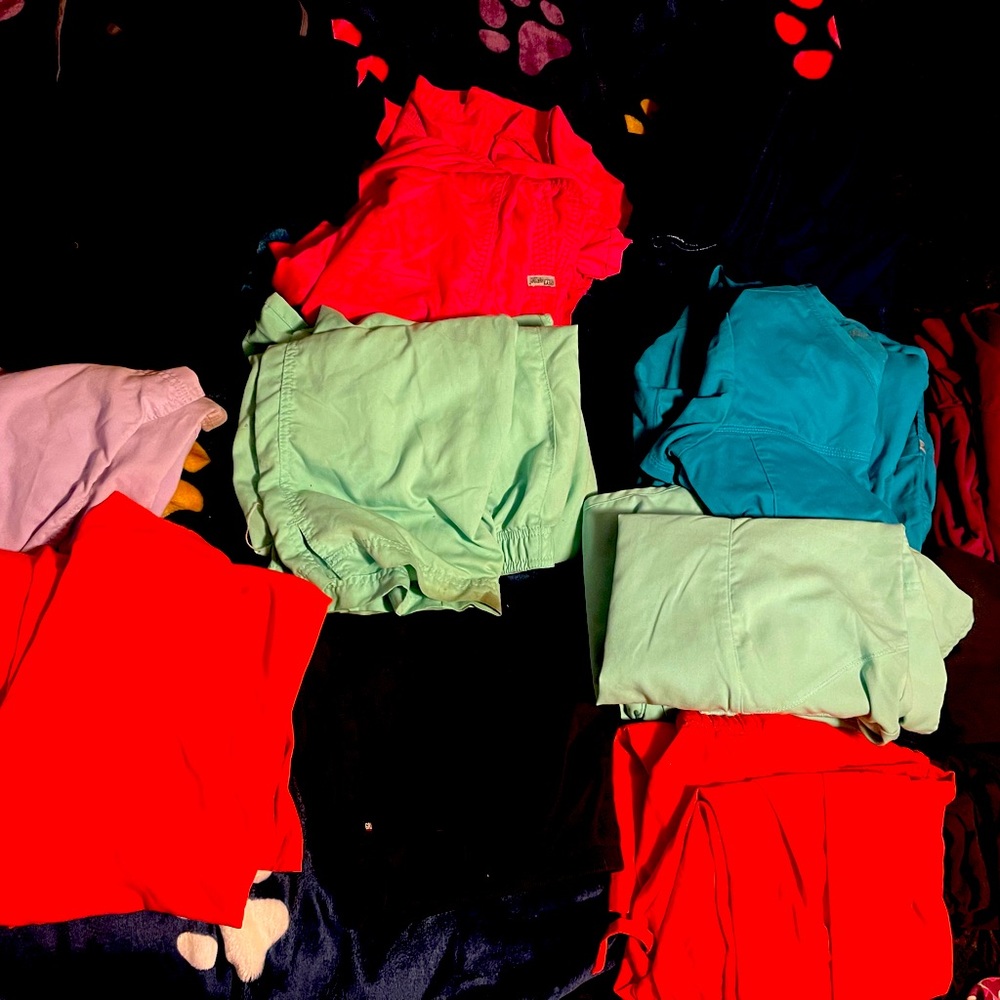 13 sets of greys anatomy scrubs and 2 extra pants